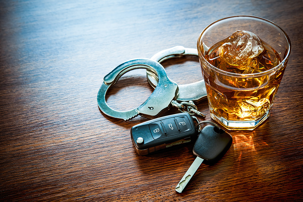 car keys, alcohol drink, and handcuffs - DWI - home page