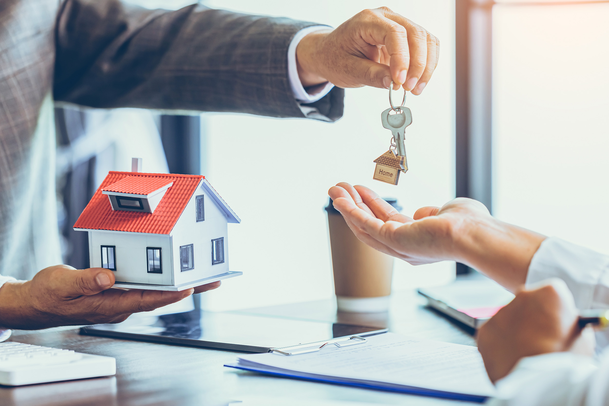 handing keys over - real estate - Justin B. Hunter